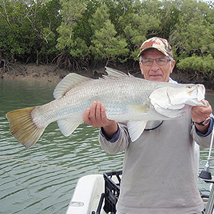 Barramundi Fishing Townsville man holding fish